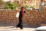 Young woman carrying water Toujane, Tunisia.