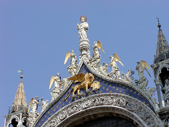 Angels and crowned lion, the gate of the Basilica San Marco, Venice, Italy