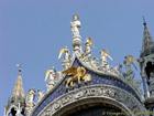 Angels and crowned lion, the gate of the Basilica San Marco, Italy.